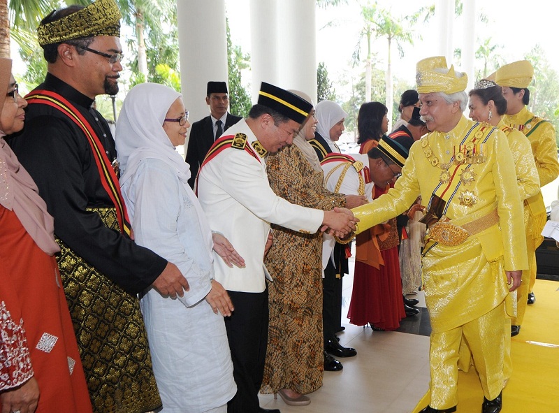 Tuanku Muhriz greets recipients of state honours at Istana Besar Seri Menanti yesterday. u00e2u20acu201d Picture by Bernama