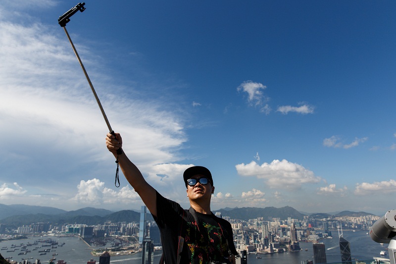 A tourist takes a selfie atop The Peak, Hong Kongu00e2u20acu2122s most popular tourist attraction. u00e2u20acu201d AFP pic