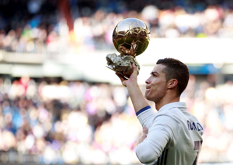 Real Madridu00e2u20acu2122s Cristiano Ronaldo holds his Ballon du00e2u20acu2122Or (Golden Ball) trophy to the crowd after winning the Fifa World Player of the Year 2016 award, before their Spanish first division football match against Granada, January 7, 2017. u00e2u20acu2022 Reuters pic