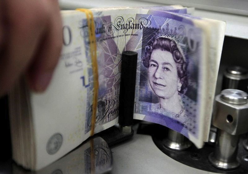 A bank employee counts pound notes at Kasikornbank in Bangkok, Thailand, October 12, 2010. u00e2u20acu201d Reuters pic
