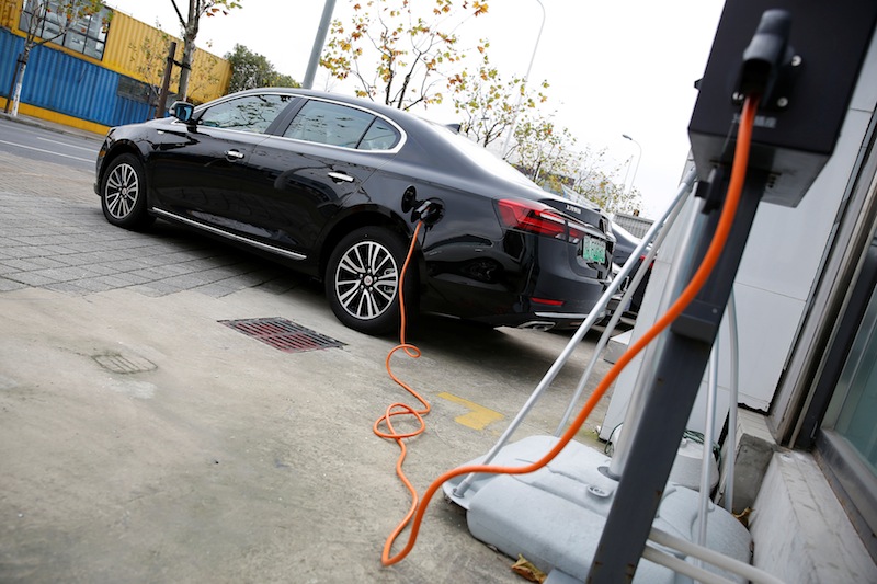 A Roewe 950 hybrid electric car is displayed with its plug-in charger at an electric car dealership in Shanghai, China, January 11, 2017. u00e2u20acu201d Reutrers pic
