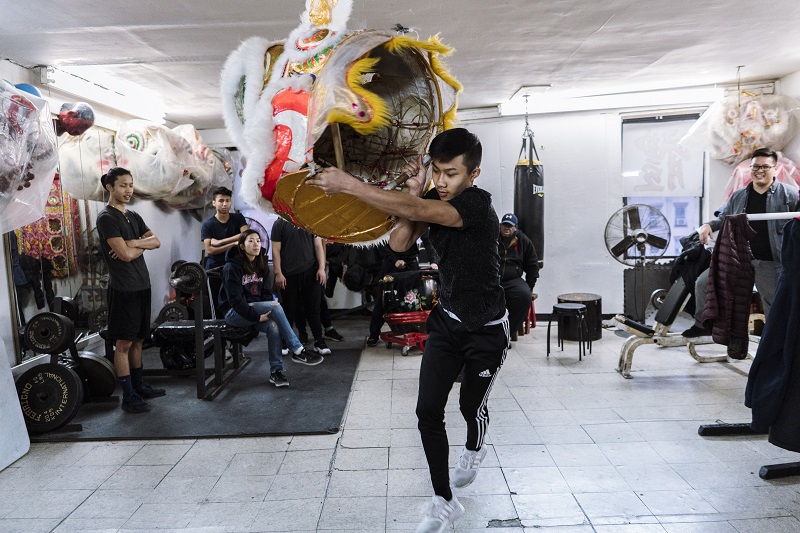 Brandon Lee, 15, practices with a lion head during a rehearsal at the New York Chinese Freemasons Athletic Club in New York, January 14, 2017.u00e2u20acu201d Picture by An Rong Xu/The New York Times