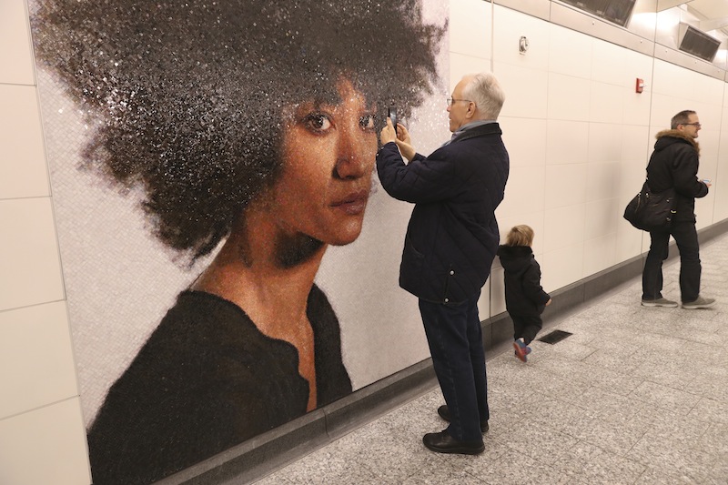 Day One riders check out art in the new Second Avenue subway station at 86th Street in New York January 1, 2017. u00e2u20acu201d Picture by Michelle V. Agins/The New York Times