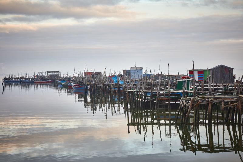 Boats at the harbour in Comporta, Portugal, November 2016. Hippie-chic Comporta is deliberately underdeveloped and teeming with creative European A-listers. u00e2u20acu2022 Picture by Andy Haslam/The New York Times