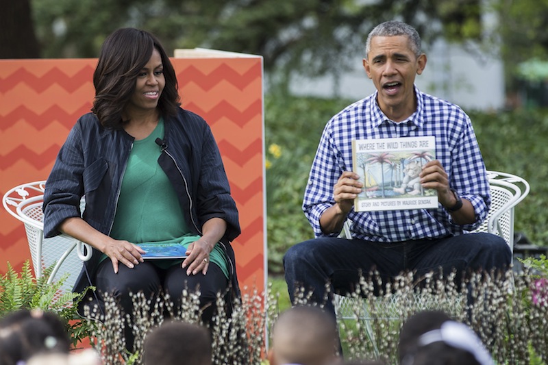 President Barack Obama and wife Michelle read 'Where the Wild Things Are' to a group of children during the 138th annual White House Easter Egg Roll, in Washington, March 28, 2016.  u00e2u20acu201d NYT pic 