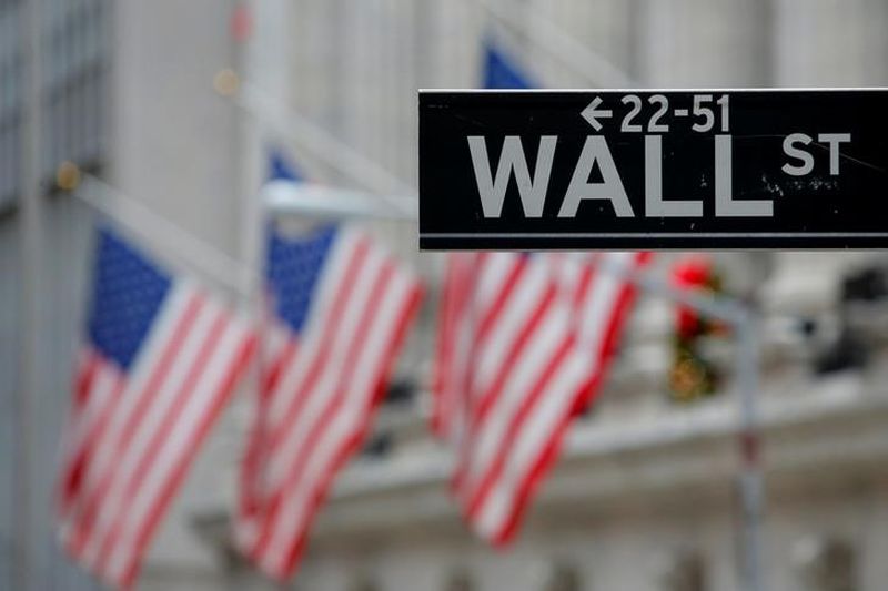 A street sign for Wall Street is seen outside the New York Stock Exchange (NYSE) in Manhattan, New York City, US December 28, 2016. u00e2u20acu201d Reuters pic
