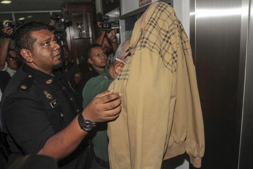 Former Tekun Chief Executive Officer and Managing Director Datuk Abdul Rahim Hassan arrives at the Shah Alam Sessions Court to face bribery charges on January 9, 2017. u00e2u20acu201d Picture by Yusof Mat Isa