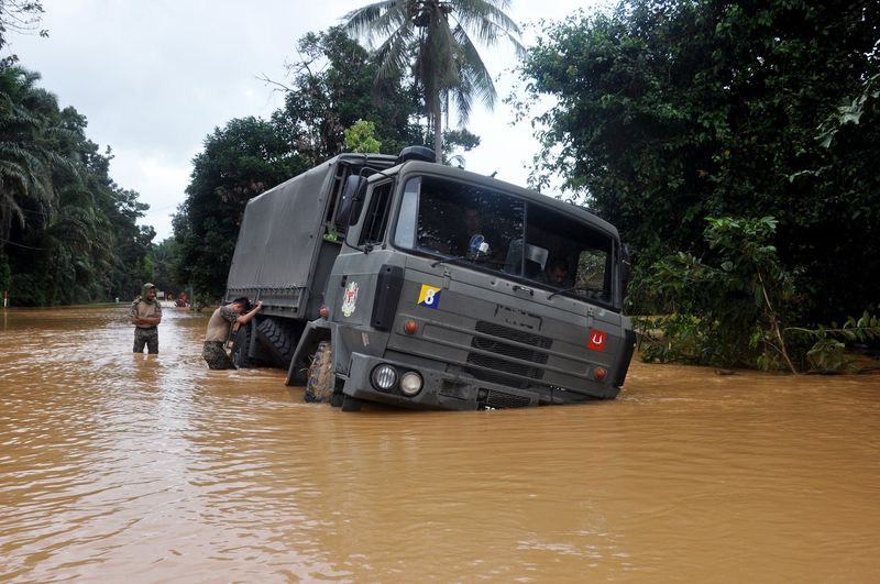 A Malaysian Armed Forces truck is stuck on a flooded road during a mission to deliver food supplies to flood victims in Kampung Nibong, Hulu Terengganu January 22, 2017. u00e2u20acu201d Bernama pic