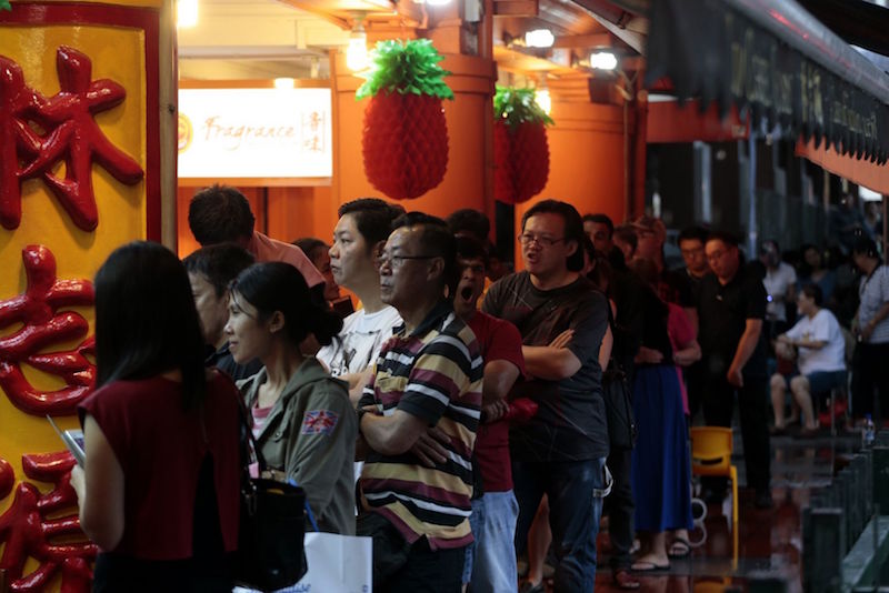 Customers queue for Lim Chee Guan barbecued meat at New Bridge Road, Singapore, January 24, 2017. u00e2u20acu201d TODAY pic