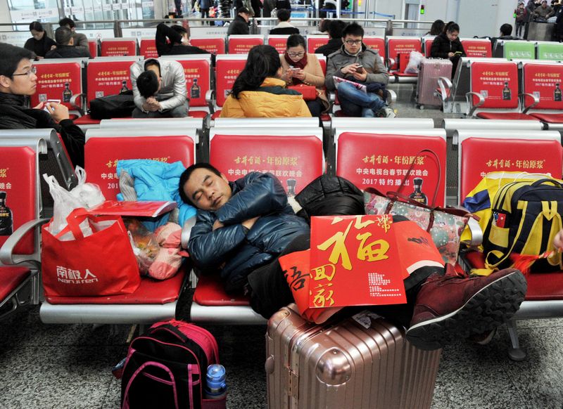 A passenger rests during the annual Spring Festival travel rush ahead of the Chinese Lunar New Year inside a railway station in Shanghai January 15, 2017. u00e2u20acu201d Reuters pic