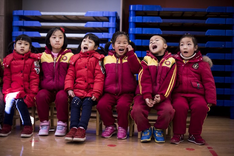 Children sing during a class at a Confucius kindergarten in Wuhan February 2, 2016. — AFP pic