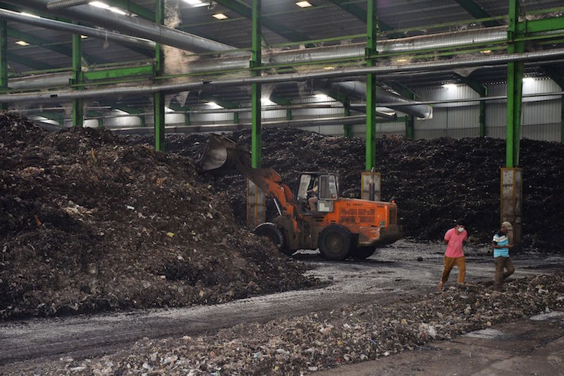 A heavy-duty earthmover machine spreading garbage at the Karnataka Compost Development Corporation (KCDC) in Bangalore January 10, 2017. u00e2u20acu201d AFP pic