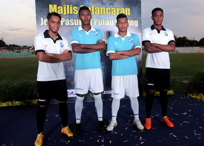 Penang Football team members, (from left) Muhammad Nabil Ramlee, Muhamad Azmeer Aris Nor Rashid, Muhammad Hidayat Ruzi and Khairul Akmal Rakishamposing posing in their teamu00e2u20acu2122s new jersey during its launch in Stadium Bandaraya Pulau Penang, George Town, J
