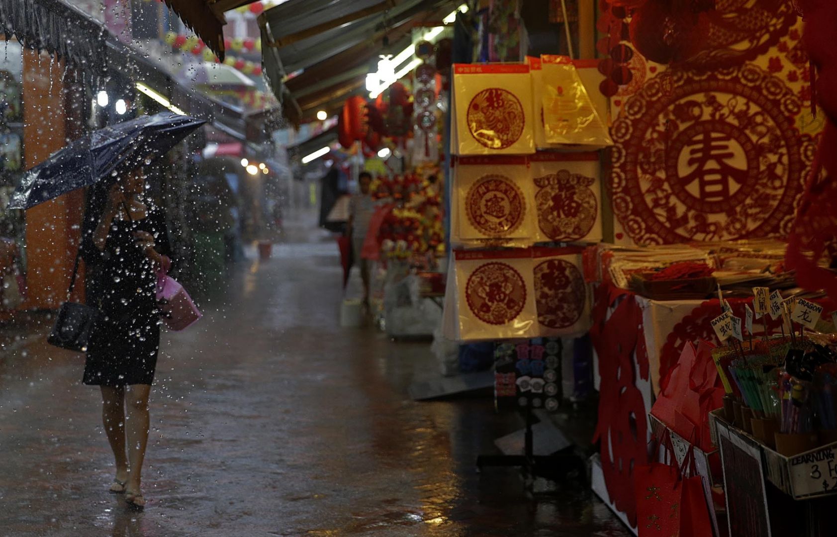 Rain in Chinatown. u00e2u20acu201du00c2u00a0TODAY file pic