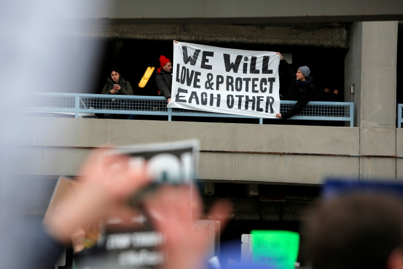 Demonstrators hang a banner from a multi-level car park during a protest against Donald Trumpu00e2u20acu2122s travel ban outside Terminal 4 at John F. Kennedy International Airport in Queens, New York January 28, 2017. u00e2u20acu201d Reuters pic