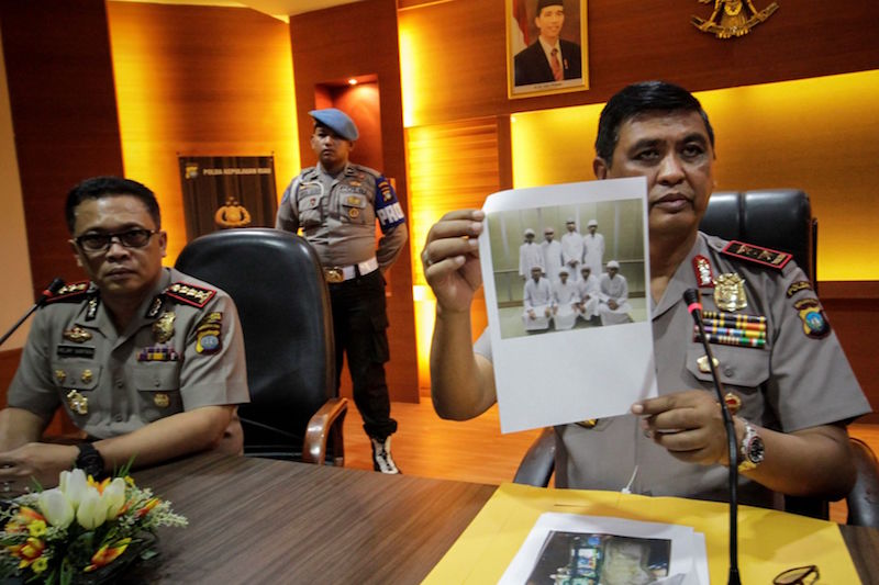 Riau Island Police chief Sam Budigusdian shows a picture of the eight suspects who were deported from Johor Baru, as he speaks at a conference in Batam on January 11, 2017. u00e2u20acu201d Reuters pic