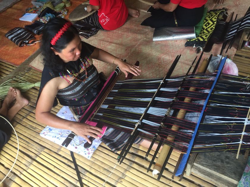 A Kampung Inukiran villager uses the Babaal Mangavol back strap loom to create traditional Rungus weavings. The art is fairly rare and mostly plied by the older generations. u00e2u20acu201d Picture by Julia Chan