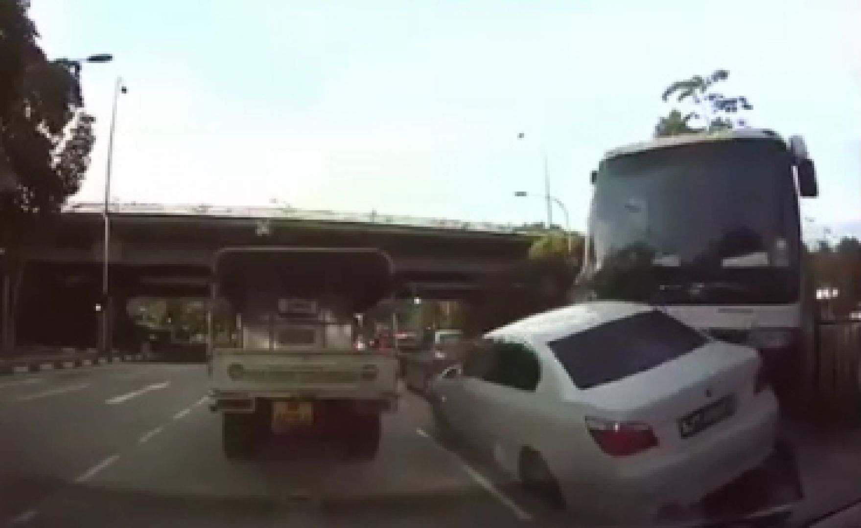 Screenshot taken from a car's dashcam video shows a private bus after it had crashed through a road divider along Pioneer Road North, Jan 12, 2017. u00e2u20acu201d Picture courtesy of Tony Ng