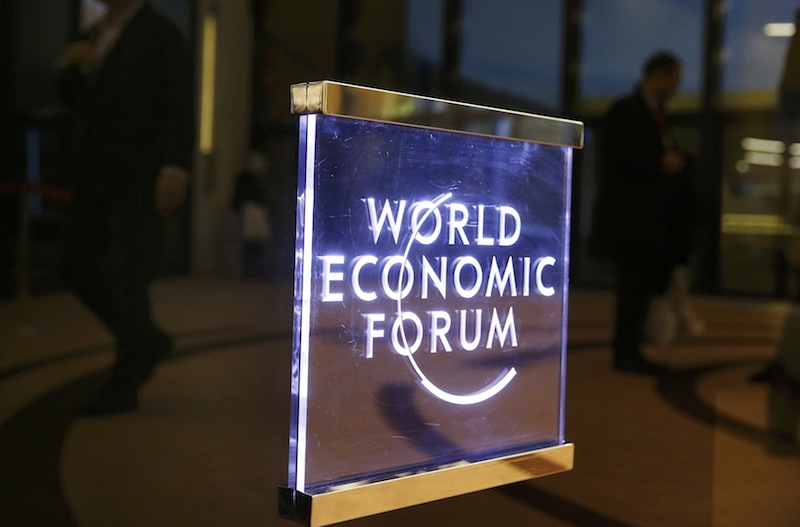 Attendees walk past a sign in the Congress Hall during the annual meeting of the World Economic Forum in Davos, Switzerland, January 17, 2017. u00e2u20acu201d reuters pic