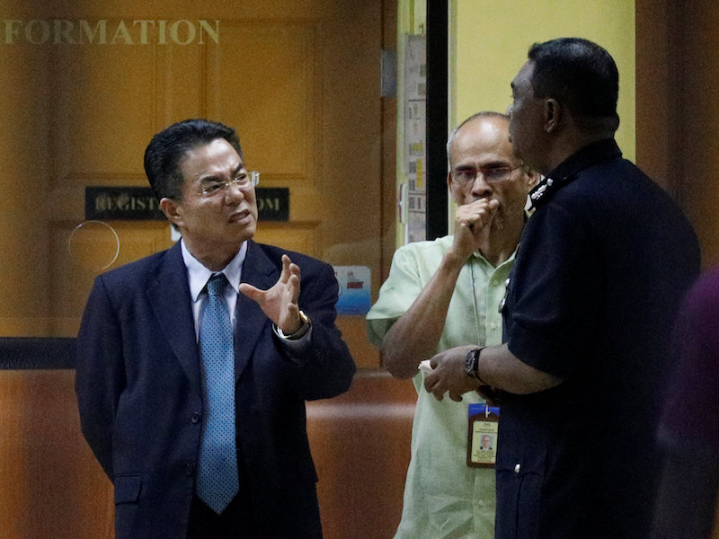 A North Korea official speaks with police at the morgue at Kuala Lumpur General Hospital where Kim Jong-namu00e2u20acu2122s body is held for autopsy in Kuala Lumpur February 15, 2017. u00e2u20acu201d Reuters pic