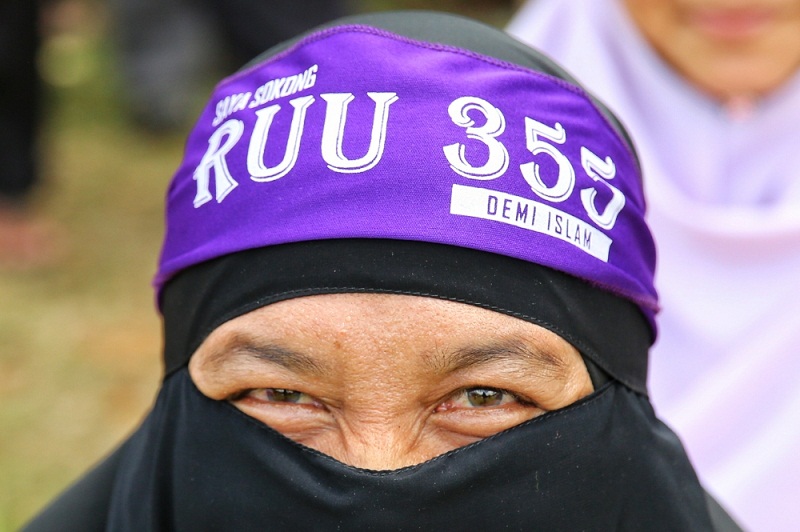 A participant poses for a picture during the PAS-led Himpunan 355 rally at Padang Merbok in Kuala Lumpur February 18, 2017. u00e2u20acu201d Picture by Saw Siow Feng