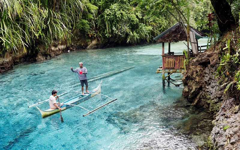 Barangay tourism workers ride on a banca as they feed fish at the Enchanted River in Hinatuan, Surigao del Sur, in southern Philippines February 19, 2017. u00e2u20acu201d Reuters pic