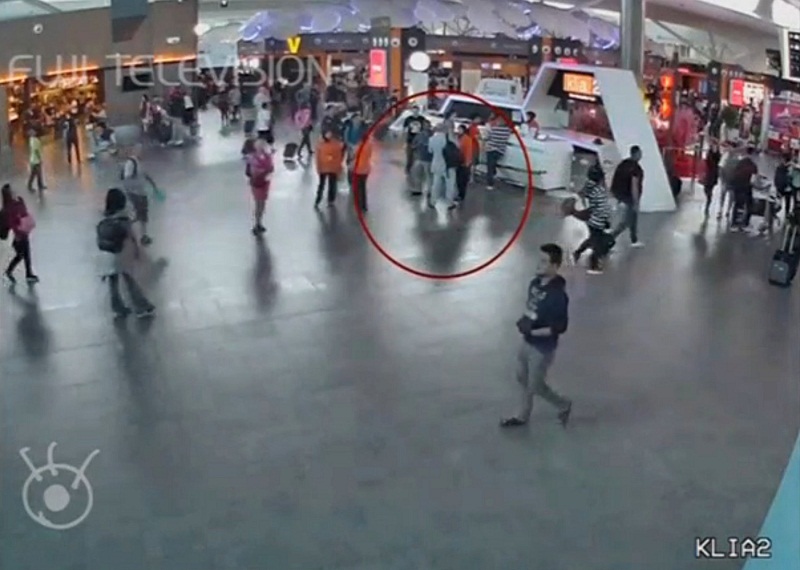 A still image from a CCTV footage appears to show a man purported to be Kim Jong-nam (circled in red) talking to airport staff, after being accosted by a woman in a white shirt, at KLIA2 on February 13, 2017. u00e2u20acu201d Reuters pic