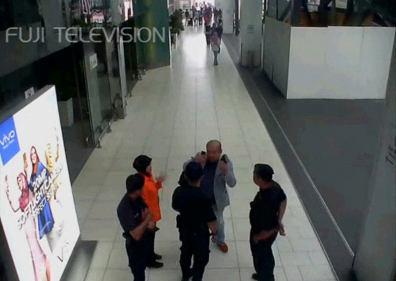 A still image from a CCTV footage appears to show a man purported to be Kim Jong-nam talking to security personnel, after being accosted by a woman in a white shirt, at KLIA2 on February 13, 2017. u00e2u20acu201d Reuters pic