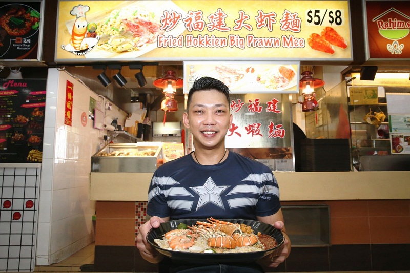 Pang Biau Juan, stall owner of Mr Prawnie, 721 Ang Mo Kio Ave 8 shows off a lobster noodle dish. u00e2u20acu201d TODAY pic