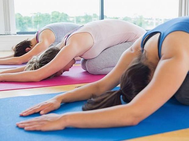 Doing restorative yoga poses such as the Child's Pose (seen here) can help give you a more restful night. u00e2u20acu2022 Picture courtesy of Elle Singapore
