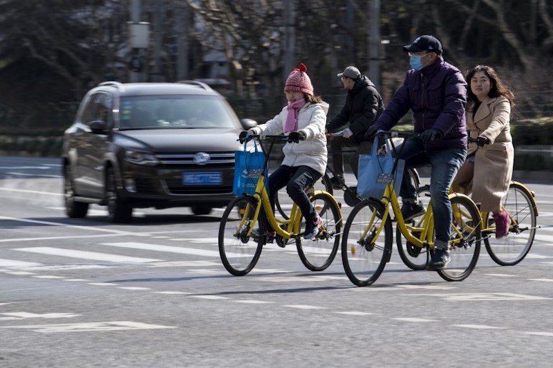 People ride Ofo-bicycles on the street in Shanghai February 2, 2017. u00e2u20acu201d AFP pic