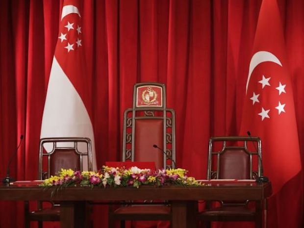 The Presidential Chair flanked by the State Flag and the Presidential Flag at the Istana. u00e2u20acu201d TODAY file pic