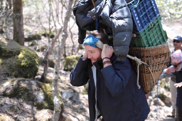 u00e2u20acu02dcExpedition Unknownu00e2u20acu2122 TV host Josh Gates carrying sherpa gear while on his hunt for the yeti in Siberia.u00c2u00a0u00e2u20acu201d Picture courtesy of Travel Channel