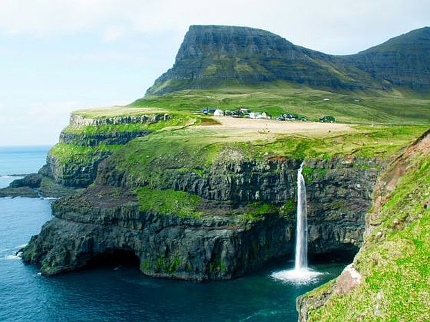 The iconic Gasadalur waterfall has made the Faroe Islands a must-visit for intrepid holiday makers. u00e2u20acu2022 Picture by  Nellie Huang/TODAY