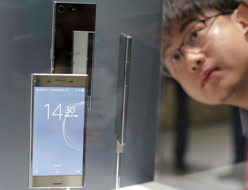 A man looks at new Sony Xperia devices as they are displayed at Mobile World Congress in Barcelona, Spain, February 27, 2017. u00e2u20acu201d Reuters pic