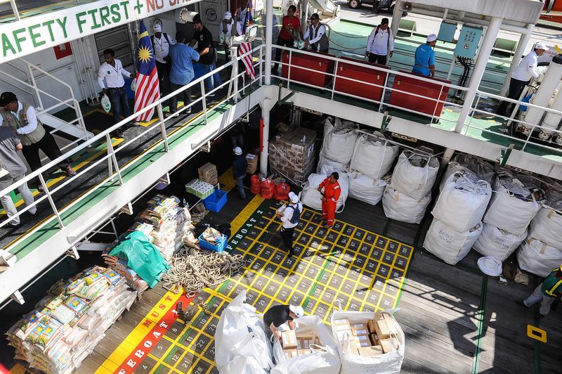Crewmembers are seen helping to load goods on board the Nautical Aliya in Port Klang, February 3, 2017. u00e2u20acu201d Bernama pic