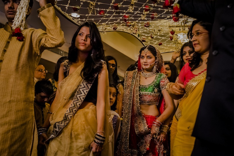 Garima Pant, a bride, is escorted to the wedding hall by her relatives and bridal party in New Delhi, India, Aug. 15, 2014. u00e2u20acu201du00c2u00a0Picture by Daniel Berehulak/The New York Times