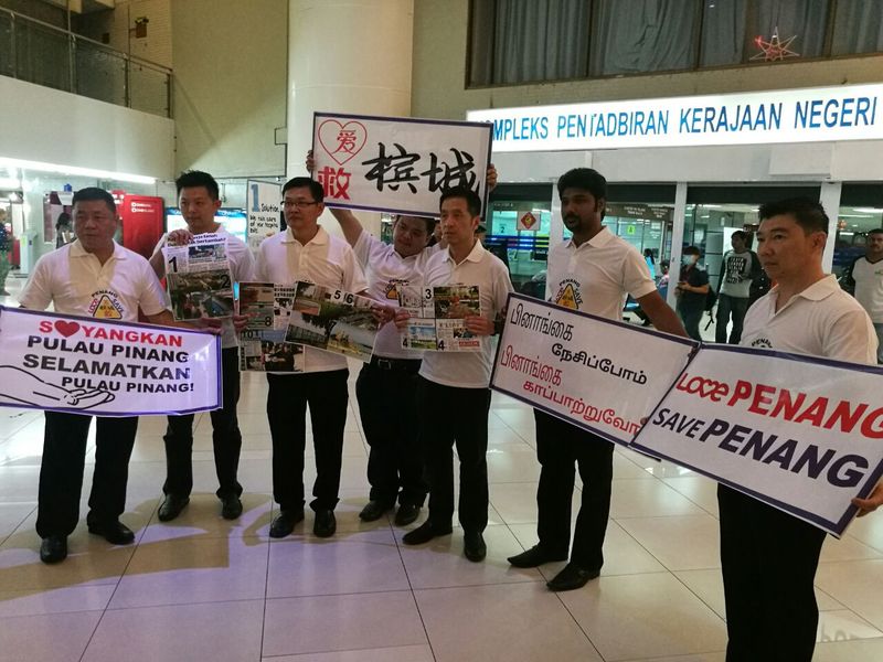 Penang Gerakan holding up banners of u00e2u20acu02dcI love Penang, save Penangu00e2u20acu2122 before handing over a memorandum and T-shirt for Penang Chief Minister Lim Guan Eng, February 14, 2017. u00e2u20acu201d Picture by Opalyn Mok