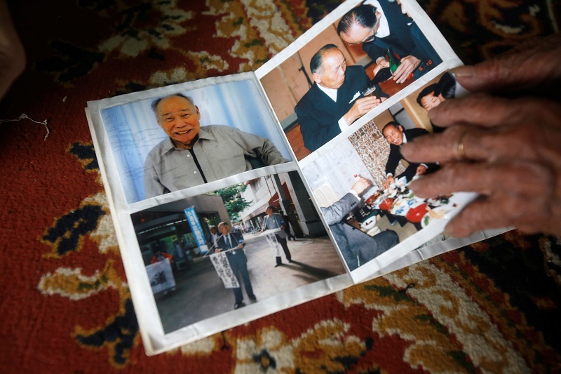 Vietnamese Nguyen Thi Xuan, 94, who married Japanese soldier Nguyen Van Duc during World War Two, shows an album with pictures of him at her house in Hanoi, Vietnam February 14, 2017. — Reuters pic