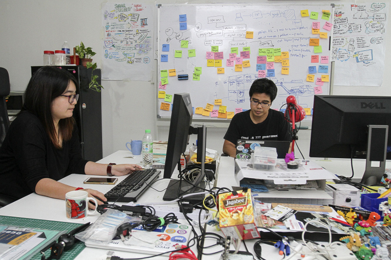 Sinar Project coordinator Khairil Yusof and programme manager Tan Sze Ming at their workspace in Subang Jaya February 12, 2017. — Picture by Yusof Mat Isa