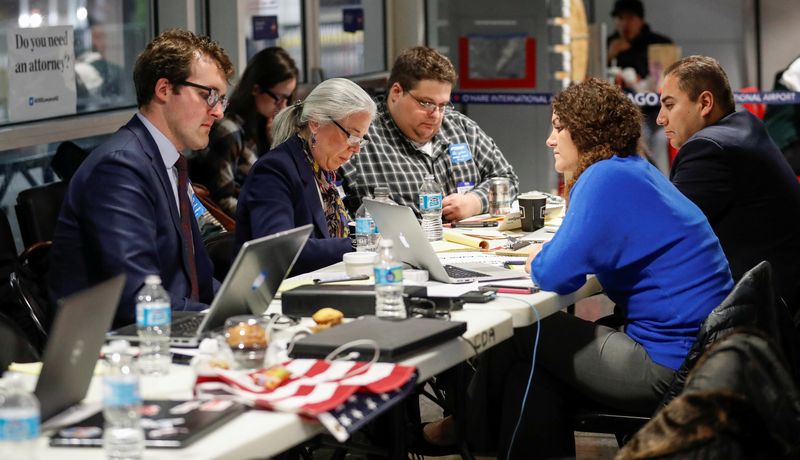 Chicago area immigration attorneys listen through their laptops to the court hearing over President Donald Trump's travel ban at O'Hare International Airport in Chicago February 7, 2017. u00e2u20acu201d Reuters pic 