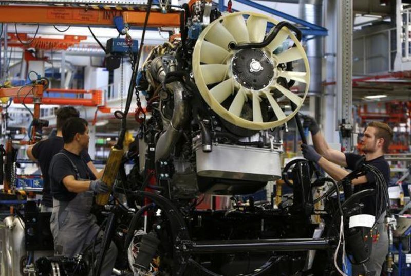 Men work at the assembly line in the truck production plant of truck and bus-maker MAN AG in Munich, Germany July 30, 2015. u00e2u20acu201d Reuters pic