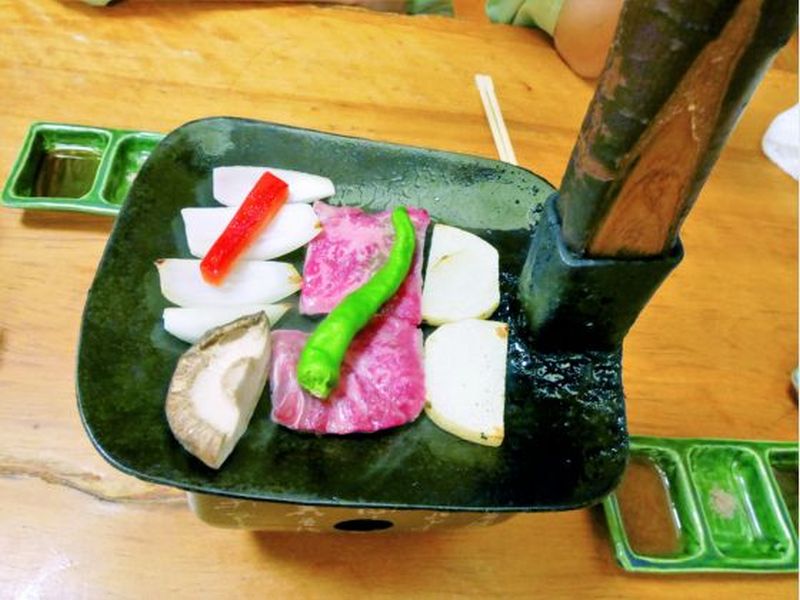 An unusual way of cooking beef is to place the meat on a pan that resembles a shovel head and grill it over a fire. ― Picture by Maureen Yeo/TODAY
