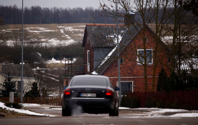A car drives on a road, about 20 km from the border with Russia in Bartninkai, Lithuania February 11, 2017. u00e2u20acu201d Reuters picnn