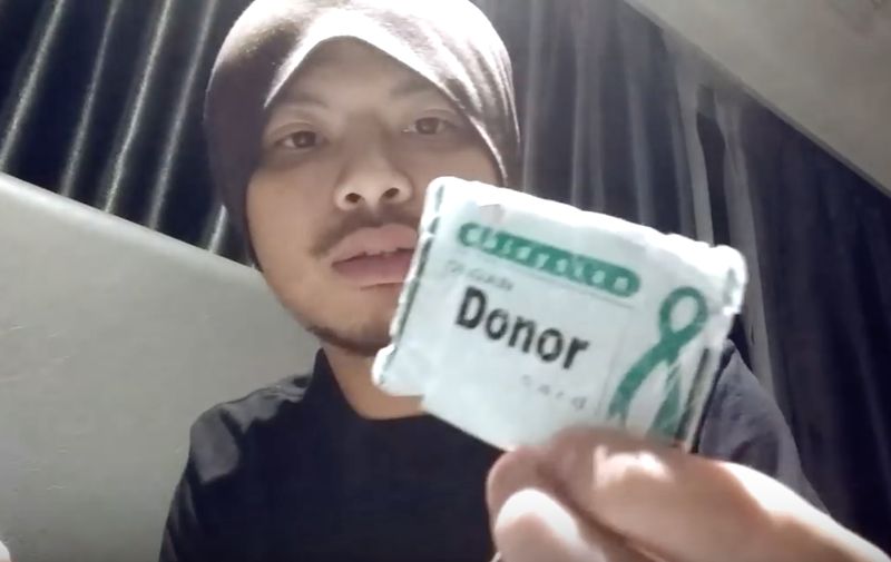 Namewee asking if his organ donor card should carry an indication that he was not a Muslim. u00e2u20acu201d YouTube videograb