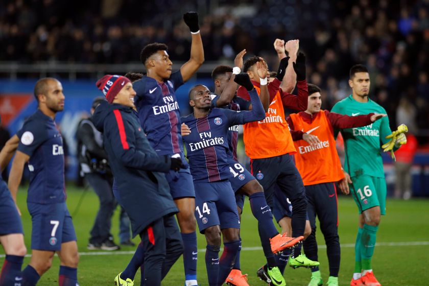 Players of Paris St Germain celebrate their victory at the end of the match against Lille. u00e2u20acu201d Reuters pic