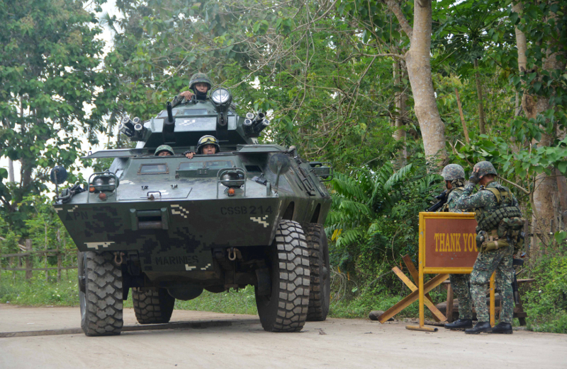Government troops conduct checkpoint operations for the German kidnap victim who was believed to be executed by Islamist militant group Abu Sayyaf in Indanan town, Sulu province February 27, 2017. u00e2u20acu201d Reuters pic