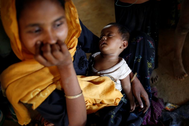 A Rohingya child sleeps on mother's lap inside their house, at Balukhali Makeshift Refugee Camp in Cox's Bazar, Bangladesh, February 8, 2017. u00e2u20acu201d Reuters pic