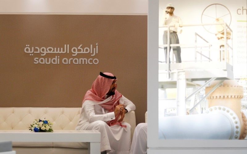 A Saudi Aramco employee sits in the area of its stand at the Middle East Petrotech 2016, an exhibition and conference for the refining and petrochemical industries, in Manama, Bahrain, September 27, 2016. u00e2u20acu2022 Reuters pic