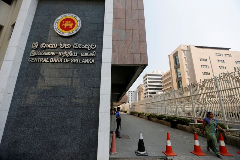 A woman walks past the main entrance of the Sri Lankau00e2u20acu2122s Central Bank in Colombo, Sri Lanka February 7, 2017. u00e2u20acu201d Reuters pic